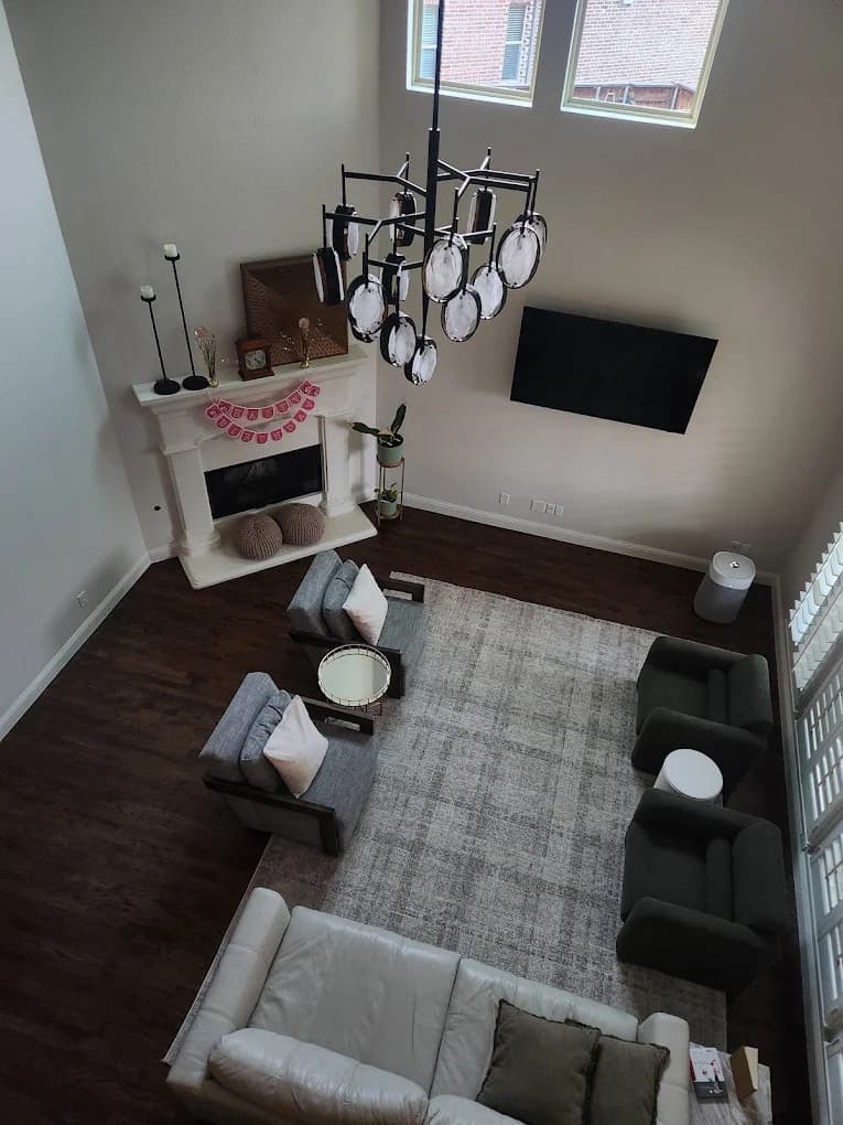 Living room chandelier installation in North Texas
