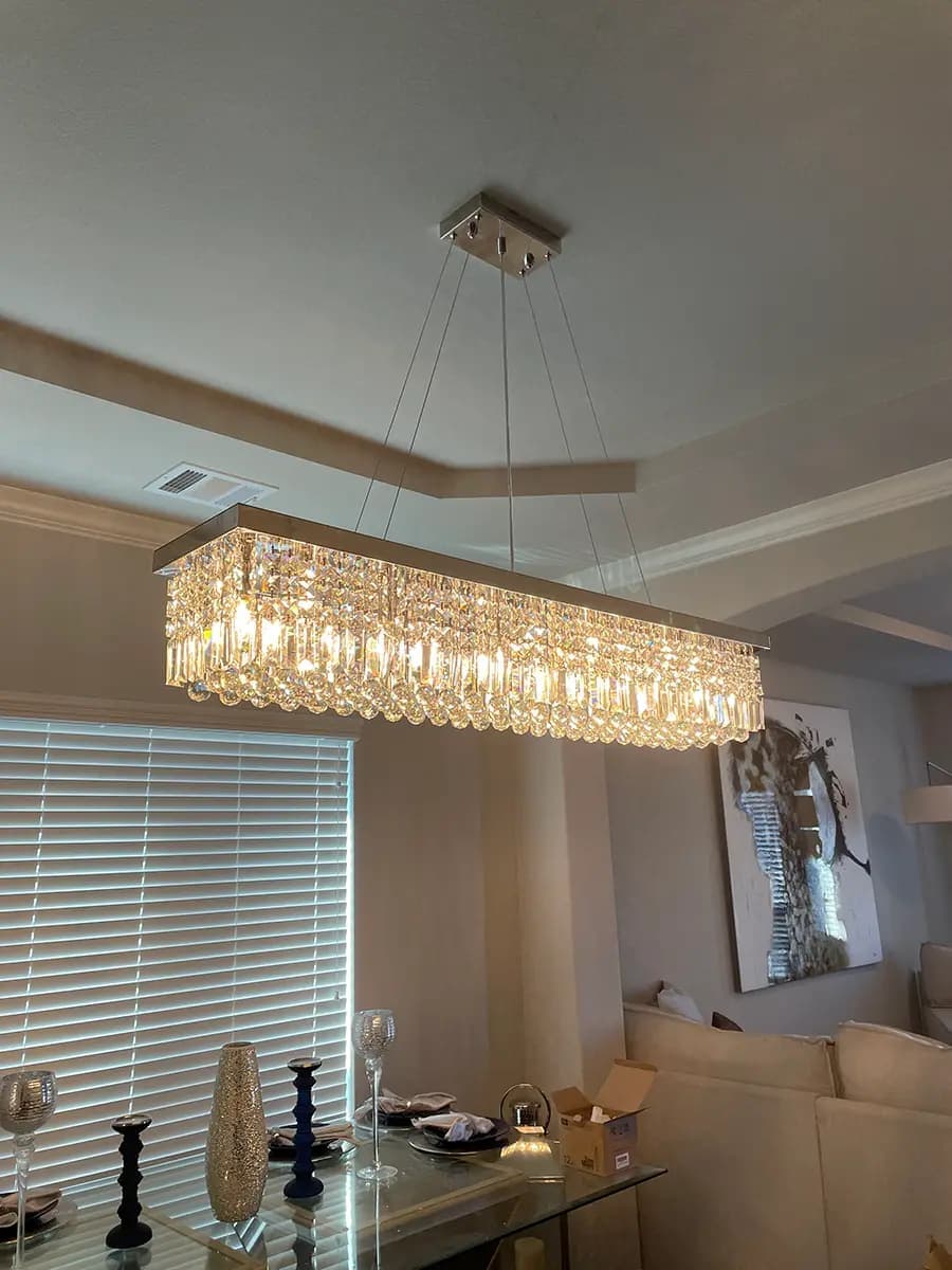 Crystal chandelier installation in a North Texas home