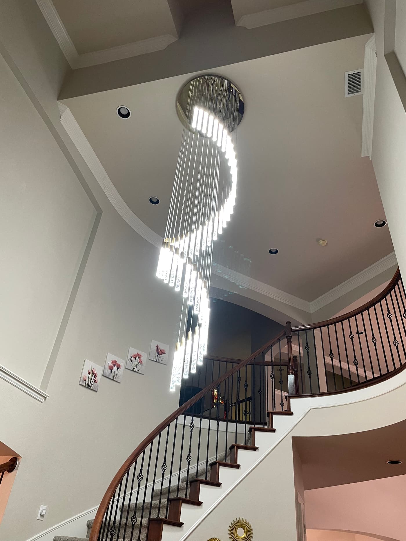 Two-story foyer chandelier installation in North Texas