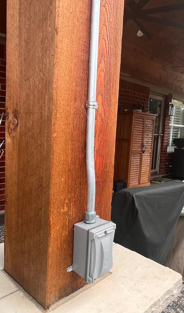 Weatherproof outdoor outlet installation in North Texas