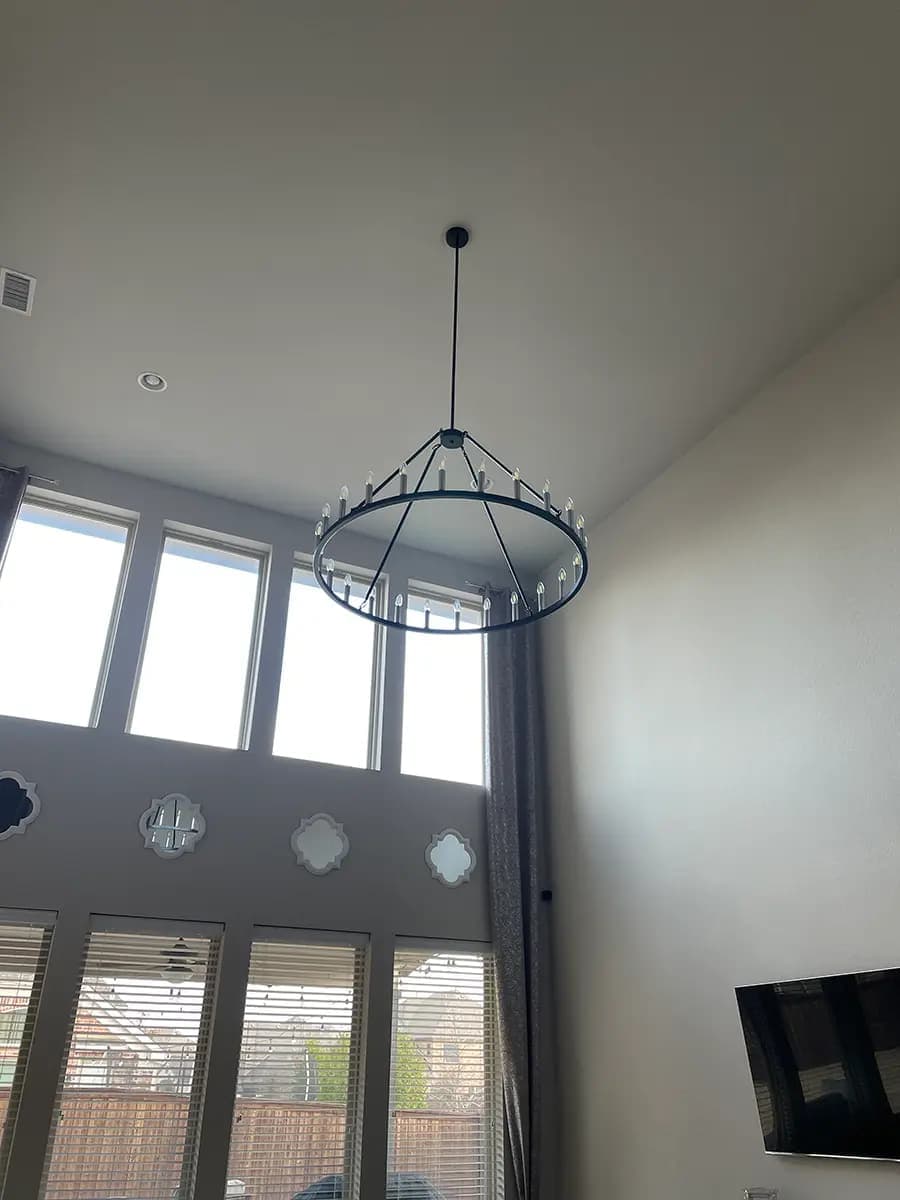Modern ring chandelier installation in North Texas